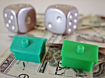Monopoly houses and die on cash