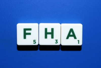 Scrabble game pieces spelling out FHA